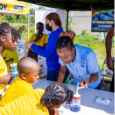 Children interacting with booth owner